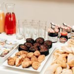 An enticing breakfast buffet with croissants, muffins, bread, juices, and spreads, perfect for a refreshing start to the day.
