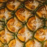 High-resolution image capturing the unique texture and pattern of pineapple skin.