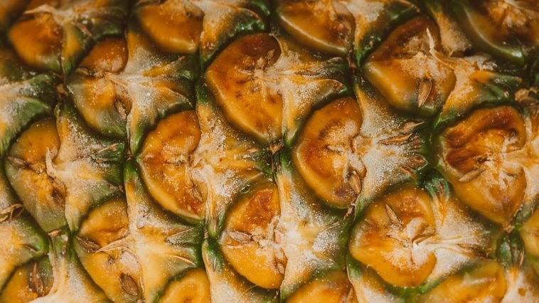 High-resolution image capturing the unique texture and pattern of pineapple skin.