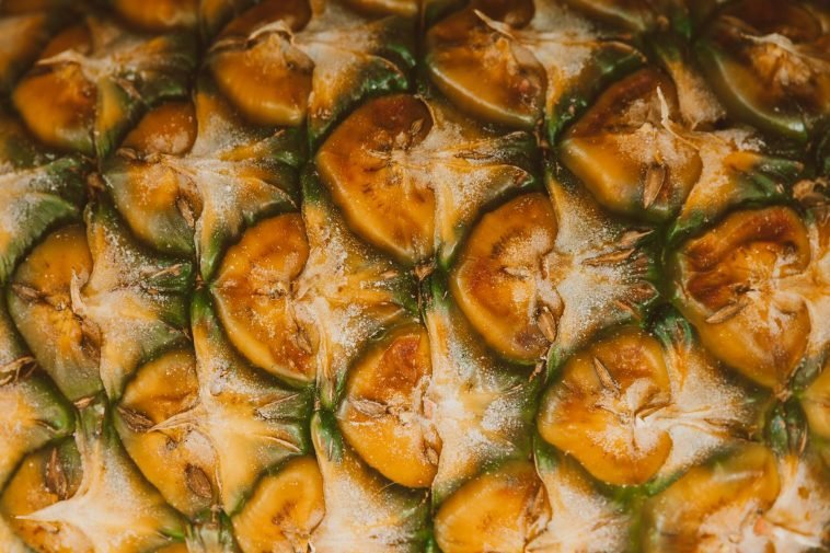 High-resolution image capturing the unique texture and pattern of pineapple skin.