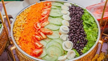 A vibrant vegetable salad platter showcasing fresh ingredients arranged beautifully for a healthy meal.