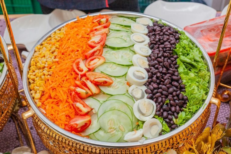 A vibrant vegetable salad platter showcasing fresh ingredients arranged beautifully for a healthy meal.