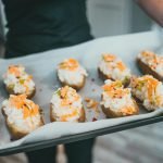 Close-up of stuffed twice-baked potatoes with cheese, ready to serve.