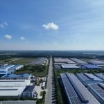 Aerial view showcasing the vast industrial park landscape under a clear blue sky in Bình Dương, Vietnam.