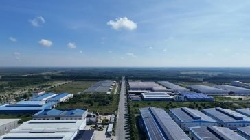 Aerial view showcasing the vast industrial park landscape under a clear blue sky in Bình Dương, Vietnam.